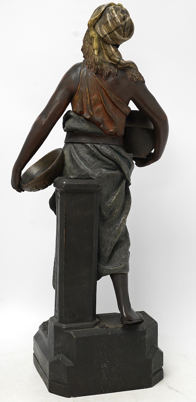 A large Austrian cold painted terracotta figure of a street seller, 59cm high. Condition - fair to good, minor chips
